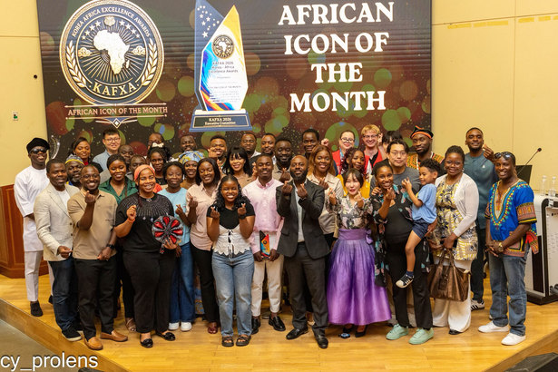 Nominees, dignitaries and guests on stage beneath the African Icon of the Month banner